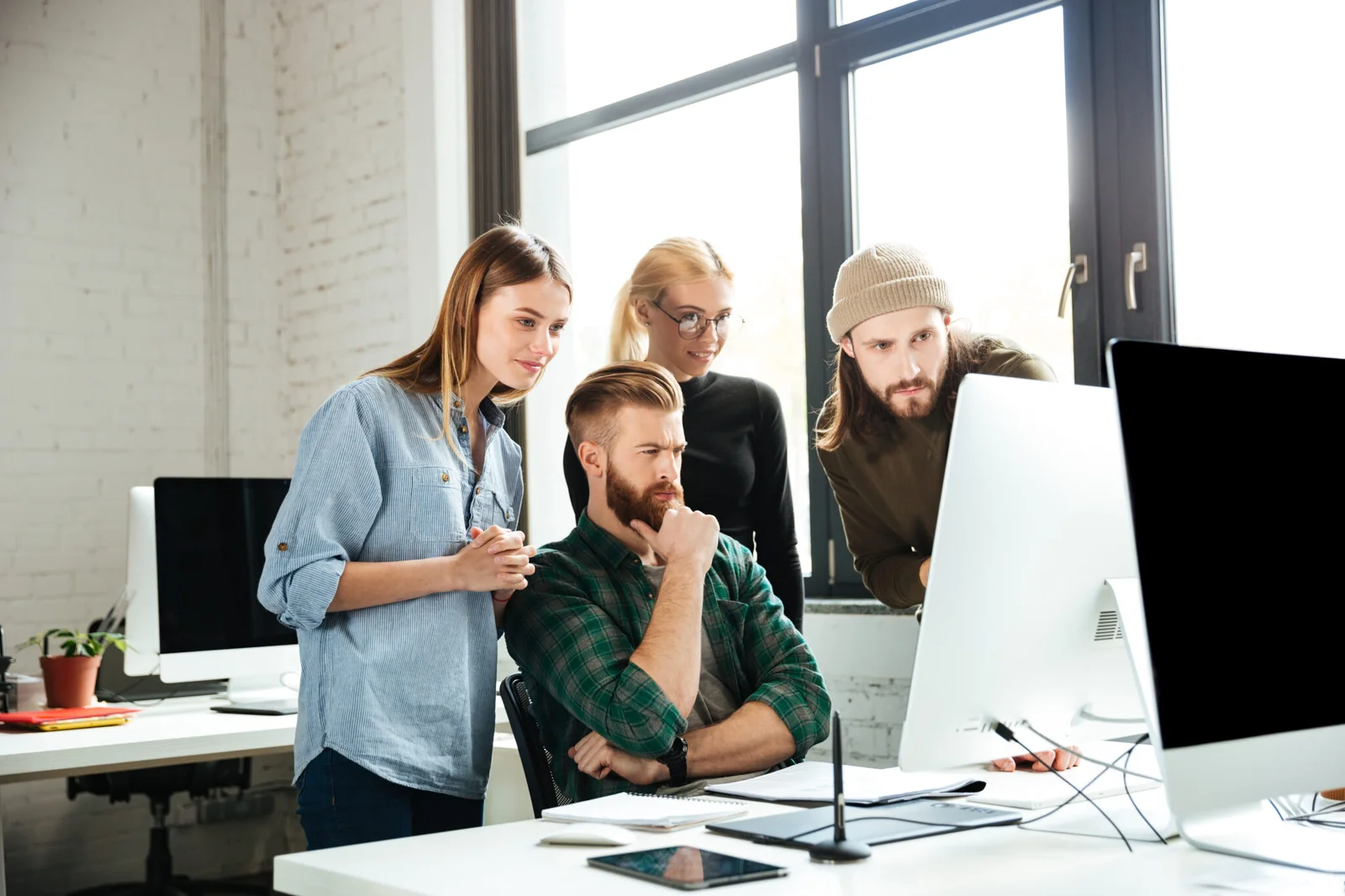 serious-colleagues-office-talking-with-each-other-2048x1365-1